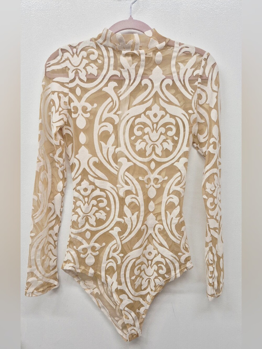 Beige sheer long-sleeve bodysuit featuring a cream-colored velvet damask print